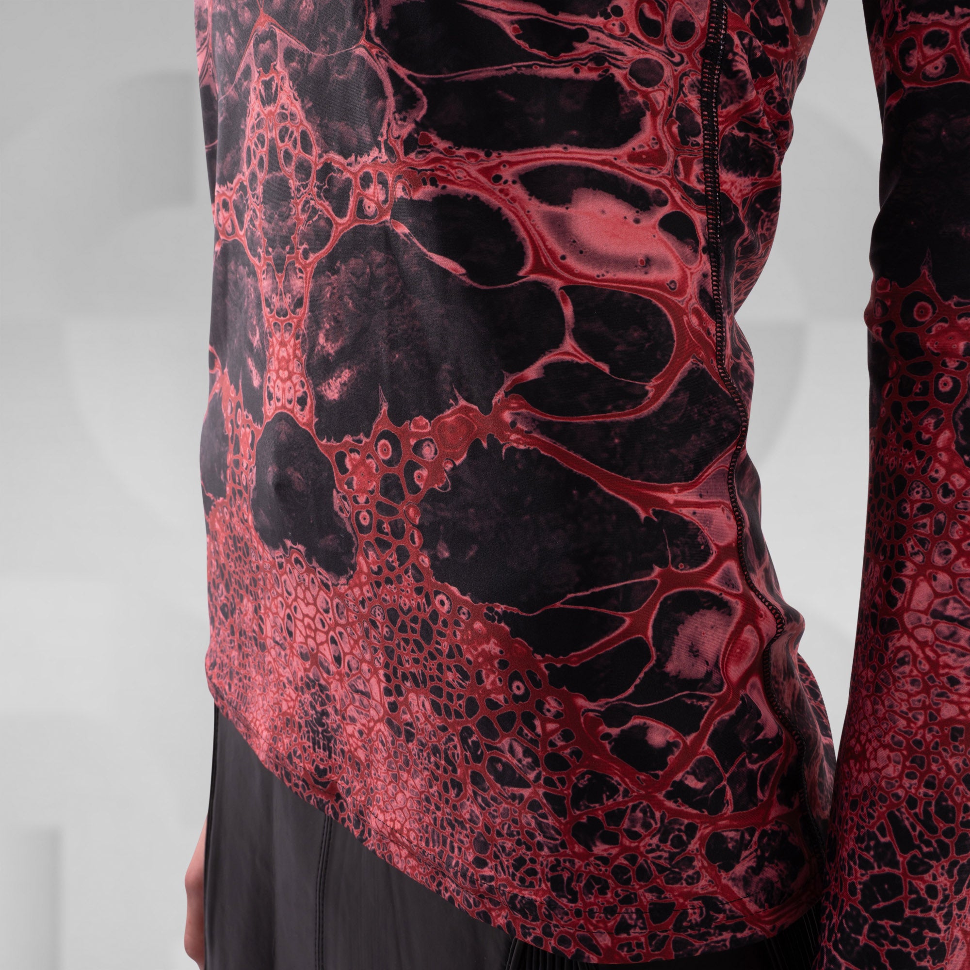 Red and black patterned fabric on a white background