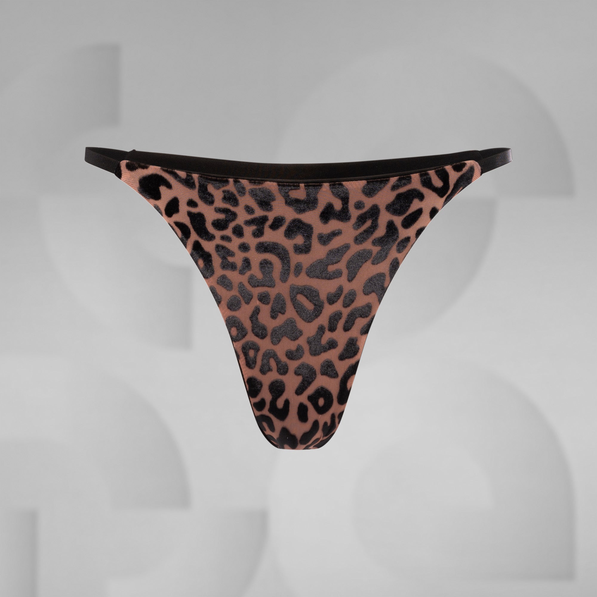 Leopard print thong on a gray background