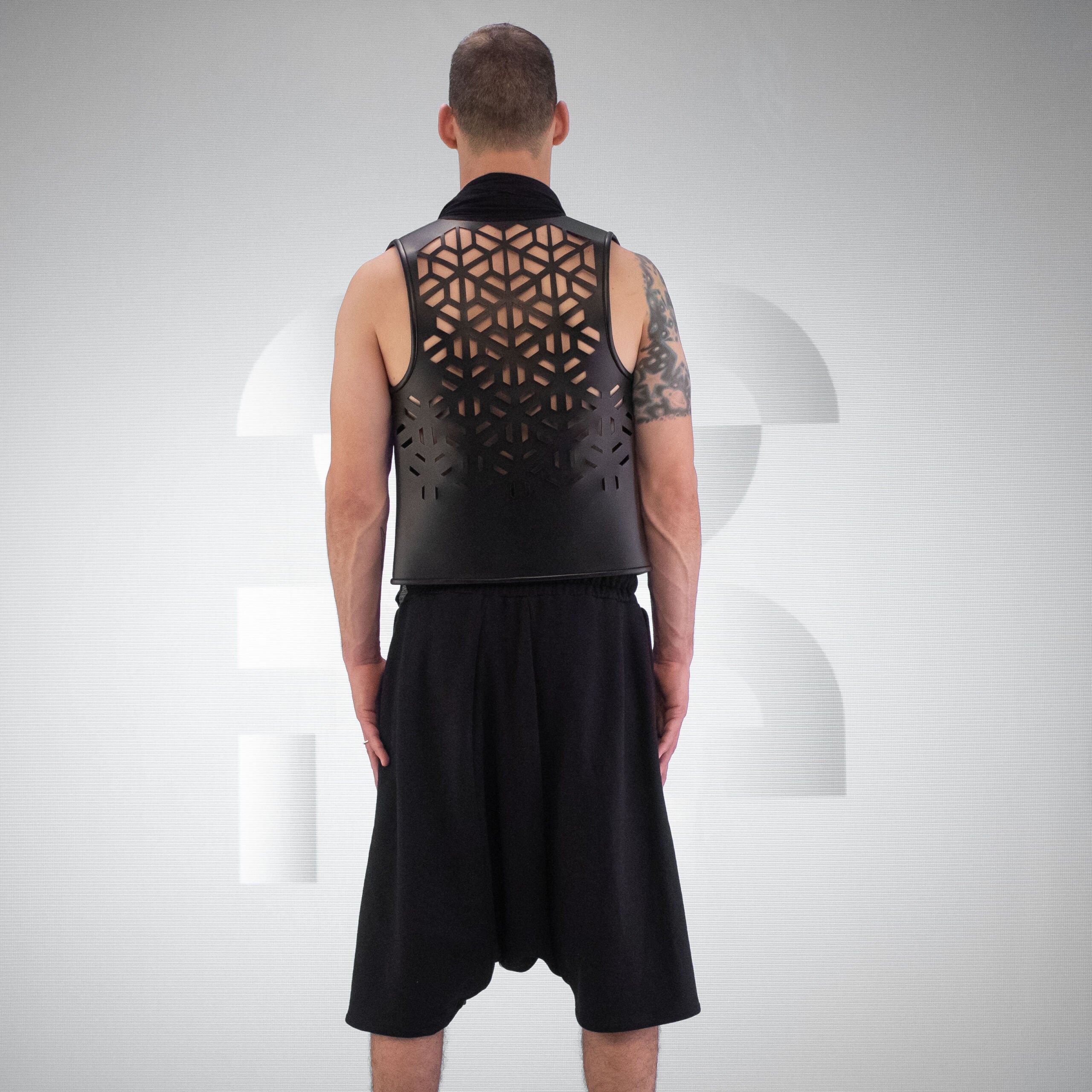 Innovative vegan leather jersey vest crafted out of premium materials with hidden pockets.