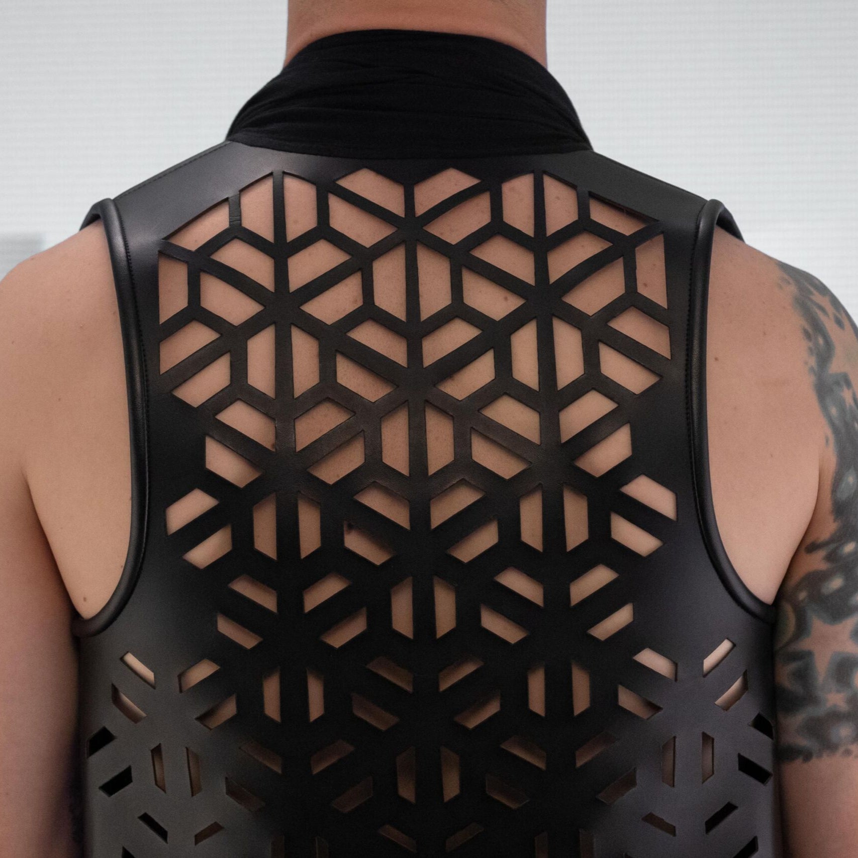 Innovative vegan leather jersey vest crafted out of premium materials with hidden pockets.