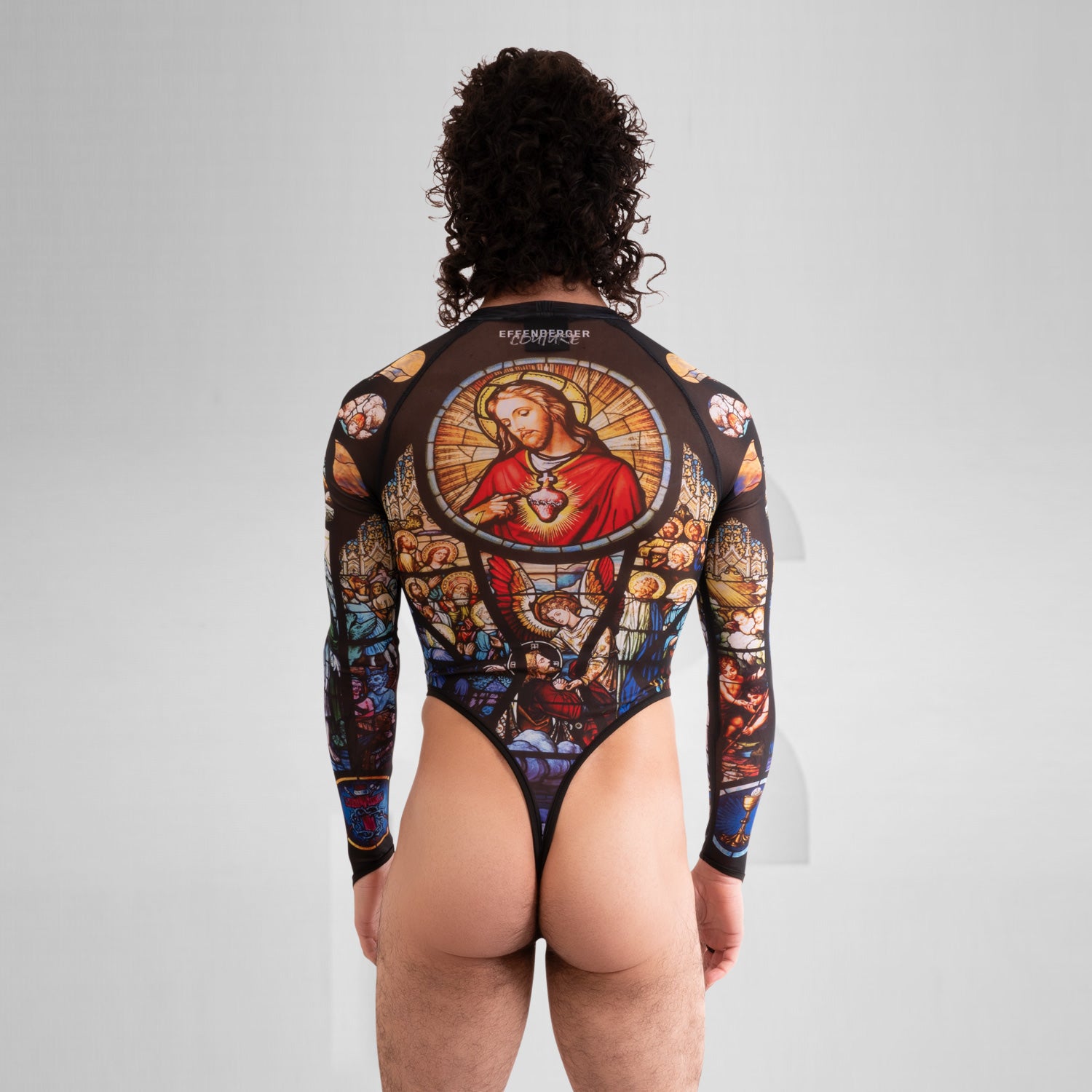 Back view of the artsy yet edgy Church Print Bodysuit with long sleeves and a thong by Effenberger Couture. 