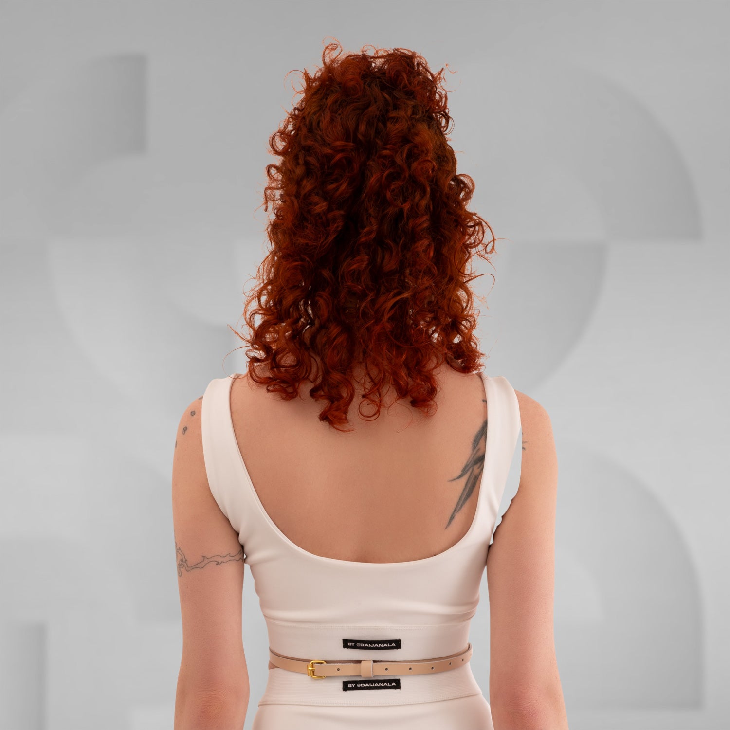 The Delicate Waist Harness in Nude Leather from Miss Overdose, crafted from real leather, elegantly displayed against a neutral background. This filigree design showcases its subtle sophistication, perfect for enhancing any outfit for various occasions, including techno clubs, festivals, and casual outings.