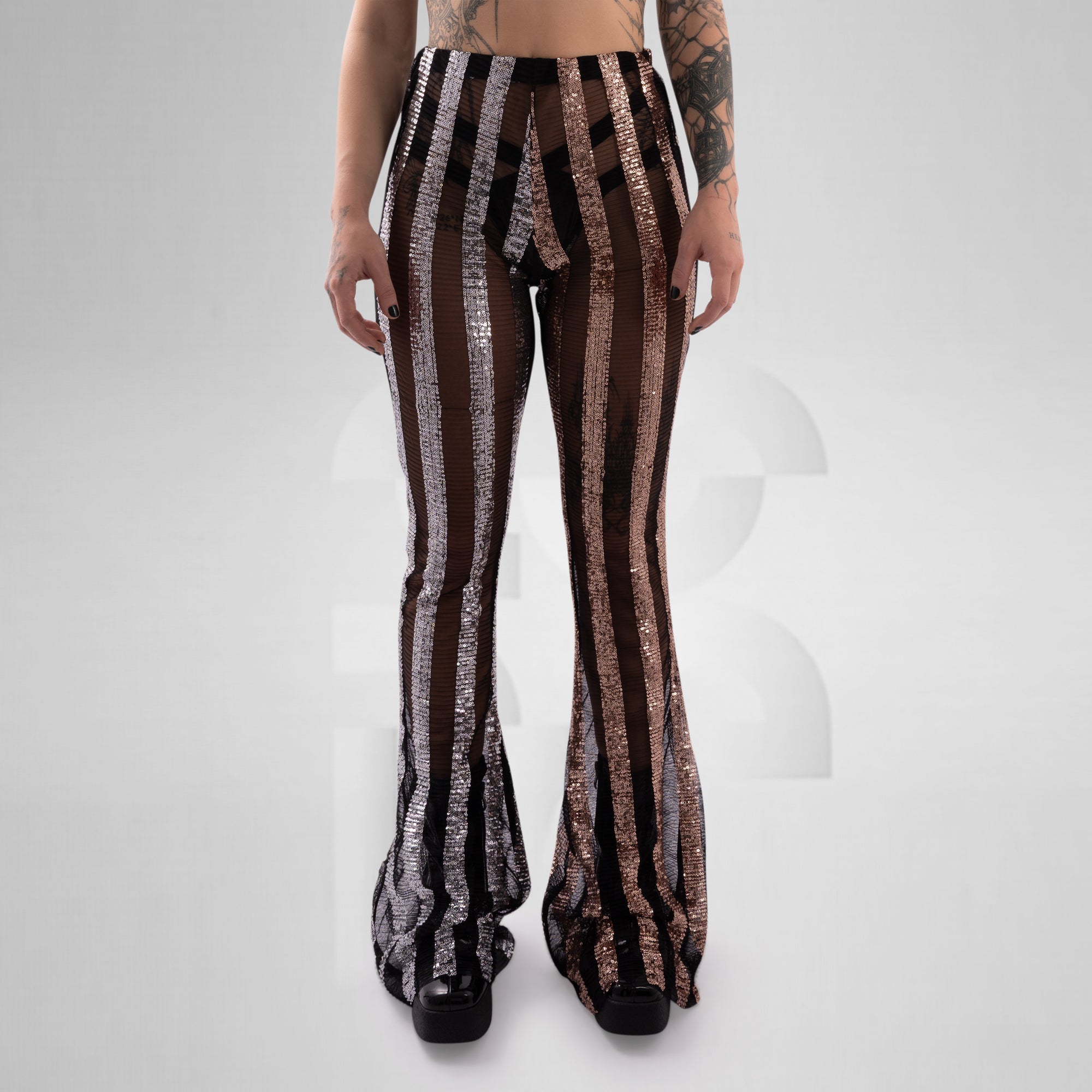 Striped pants worn by a person on a white background