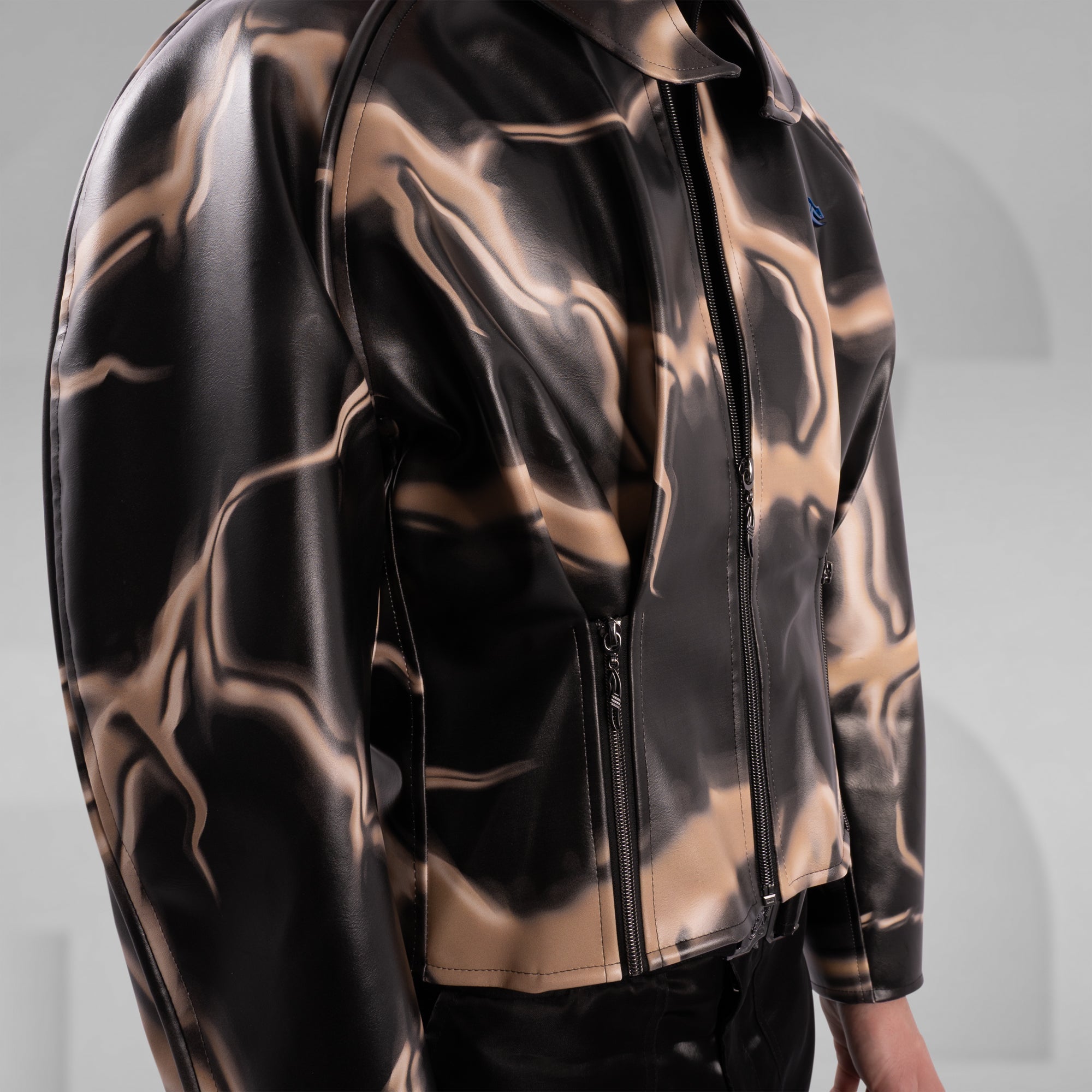 Black and gold reflective jacket on a gray background