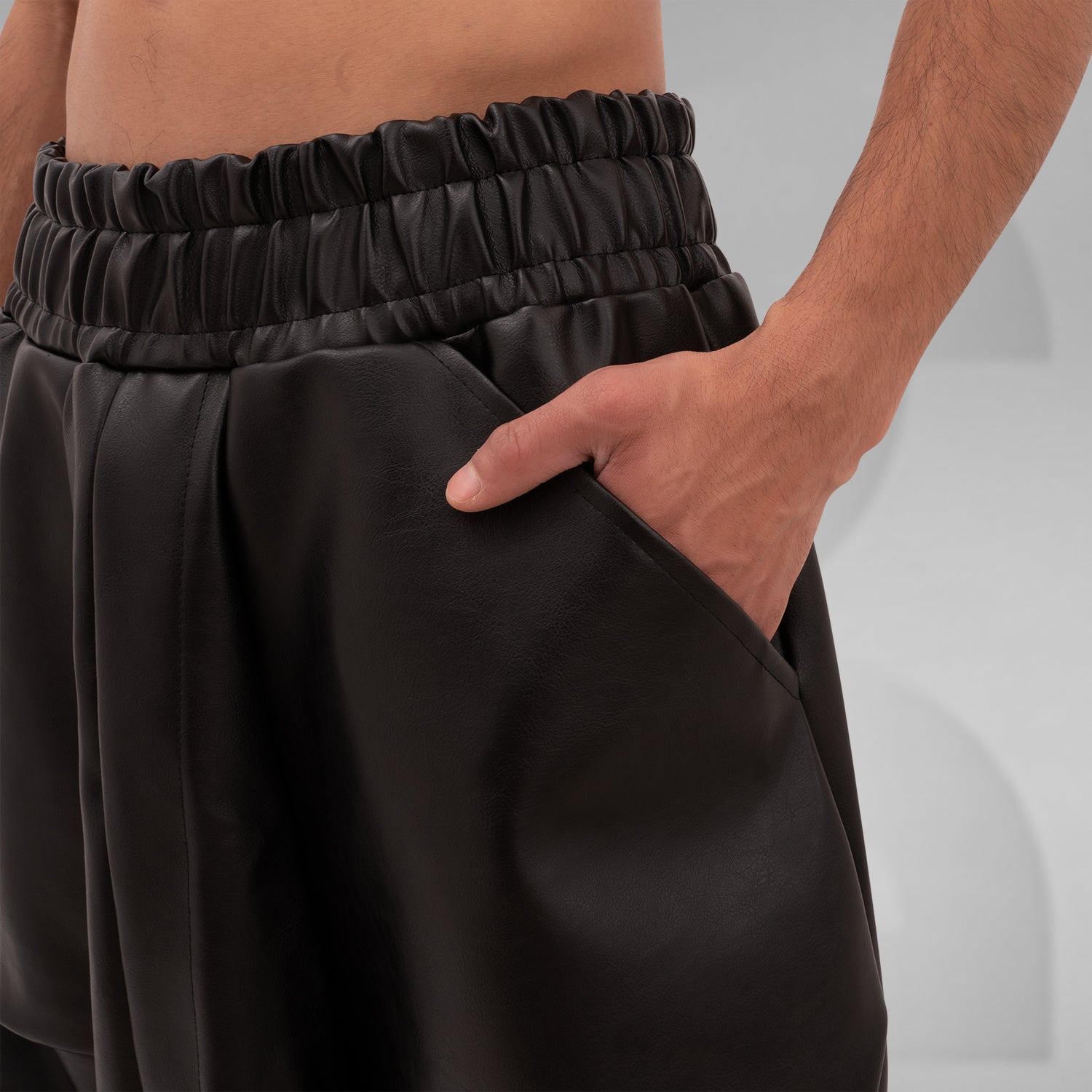 The Faux Leather Balloon Trousers from This is Fred feature a bold and modern silhouette that redefines contemporary style. Crafted from faux leather, these trousers combine luxury with sustainability, making them a standout addition to any wardrobe. The unique balloon shape allows for freedom of movement while adding an avant-garde touch to your look.