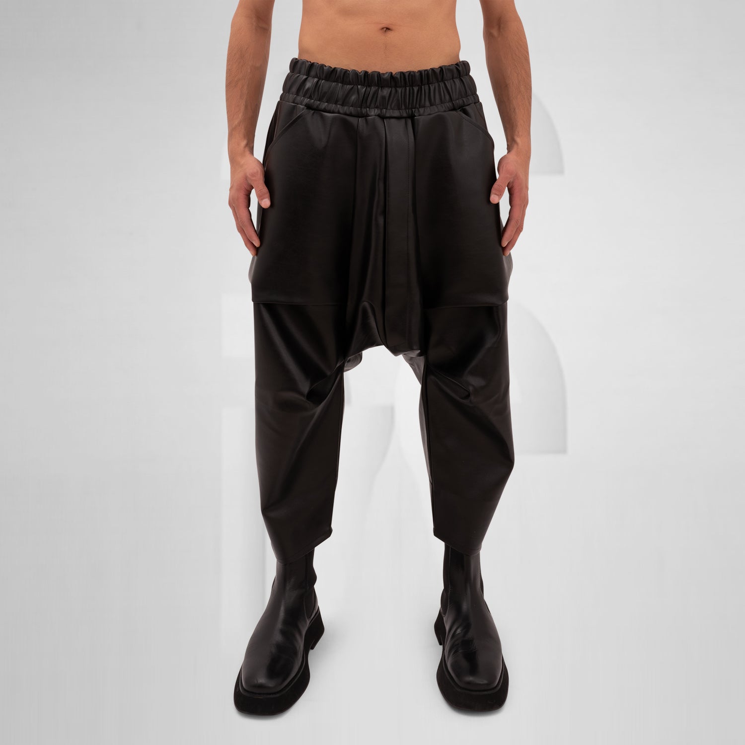 The Faux Leather Balloon Trousers from This is Fred feature a bold and modern silhouette that redefines contemporary style. Crafted from high-quality vegan leather, these trousers combine luxury with sustainability, making them a standout addition to any wardrobe. The unique balloon shape allows for freedom of movement while adding an avant-garde touch to your look.