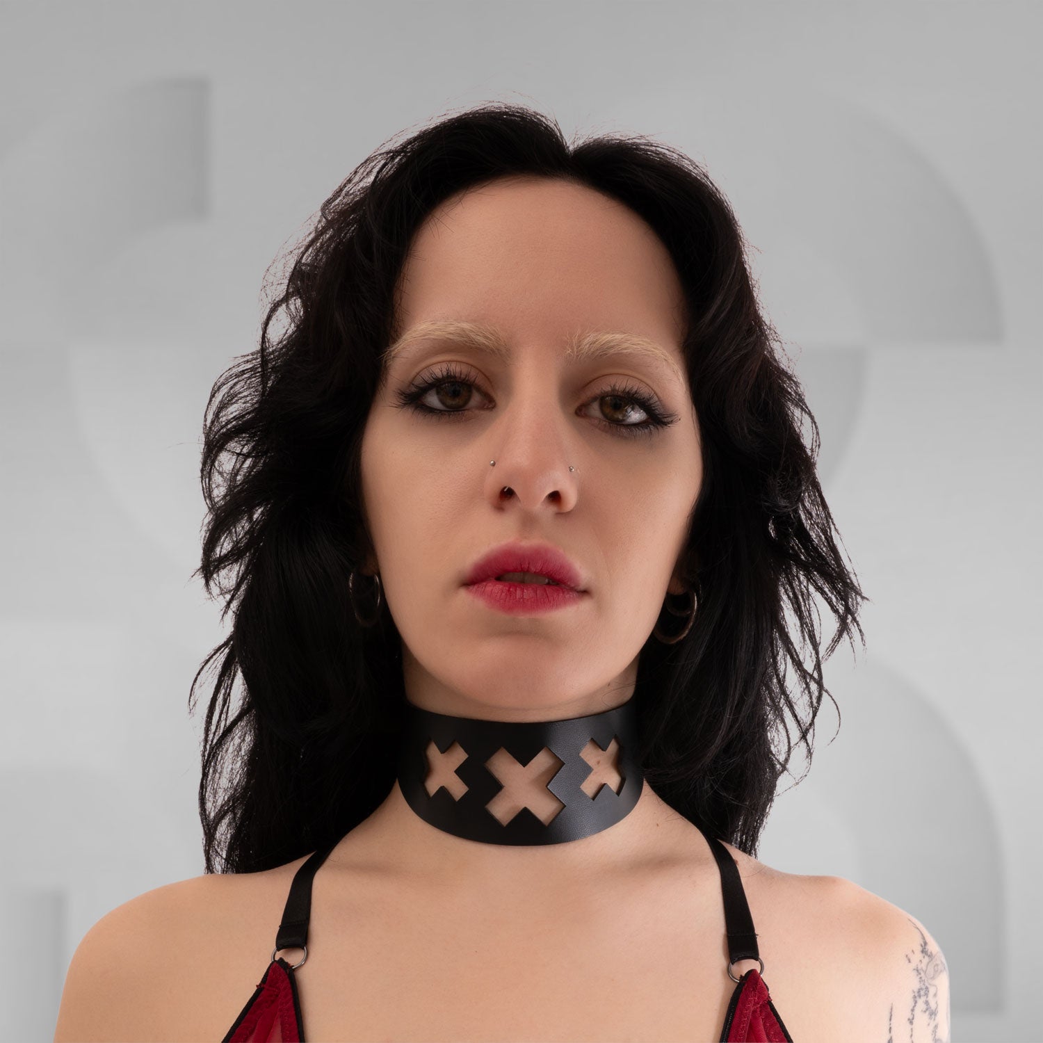 Intricate triple-X laser-cut choker for a distinctive, modern aesthetic.