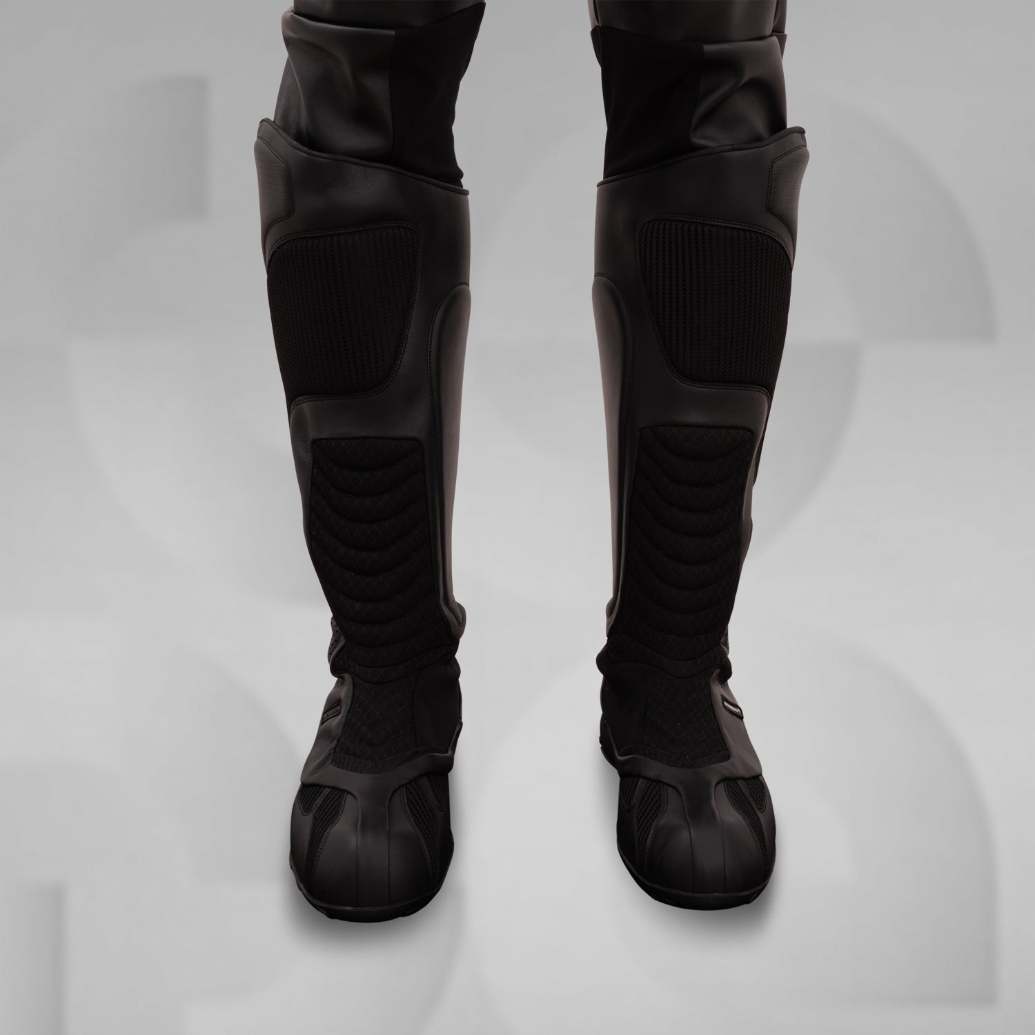 The image features sleek, futuristic black boots with a high, protective design. These avant-garde boots boast textured panels and reinforced sections, combining style and functionality. Ideal for fashion-forward individuals, they offer both comfort and edgy aesthetics, making them perfect for urban adventures or making a statement in any environment.