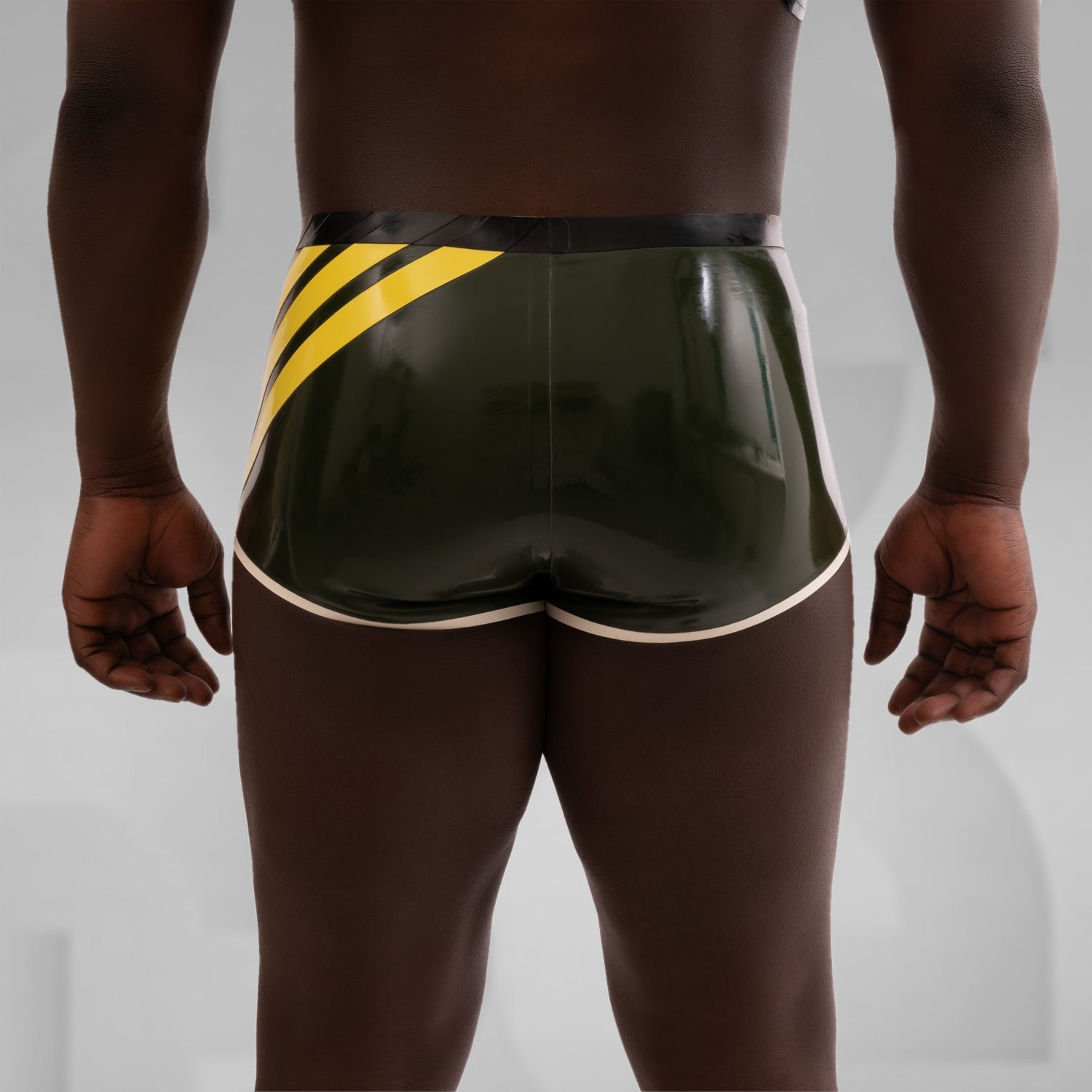 Image of a stunning pair of dark green latex hot pants featuring a 3D Latex brand ornament on the side.