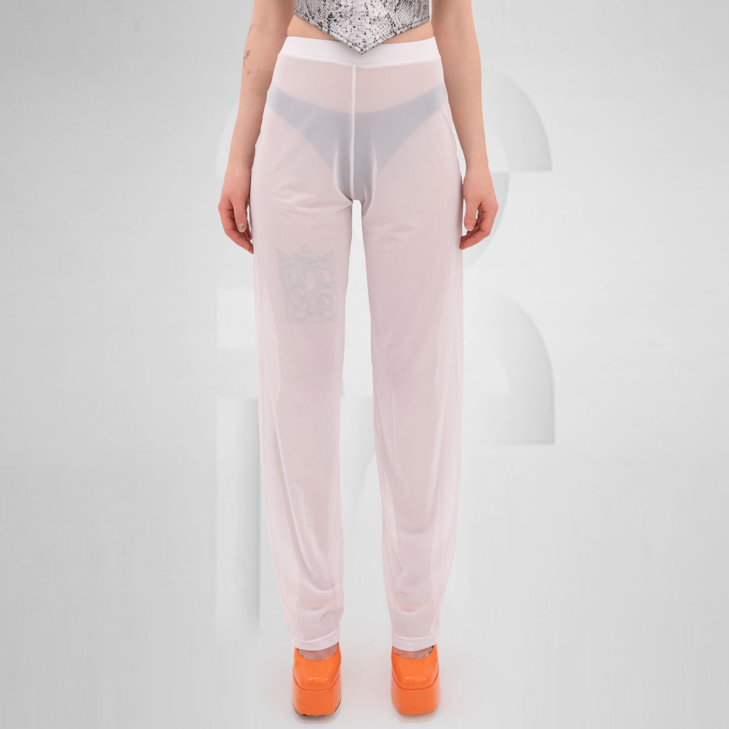 White Pants from THE CODE displayed on a model, showcasing their stylish, breathable design ideal for summer and nightlife.