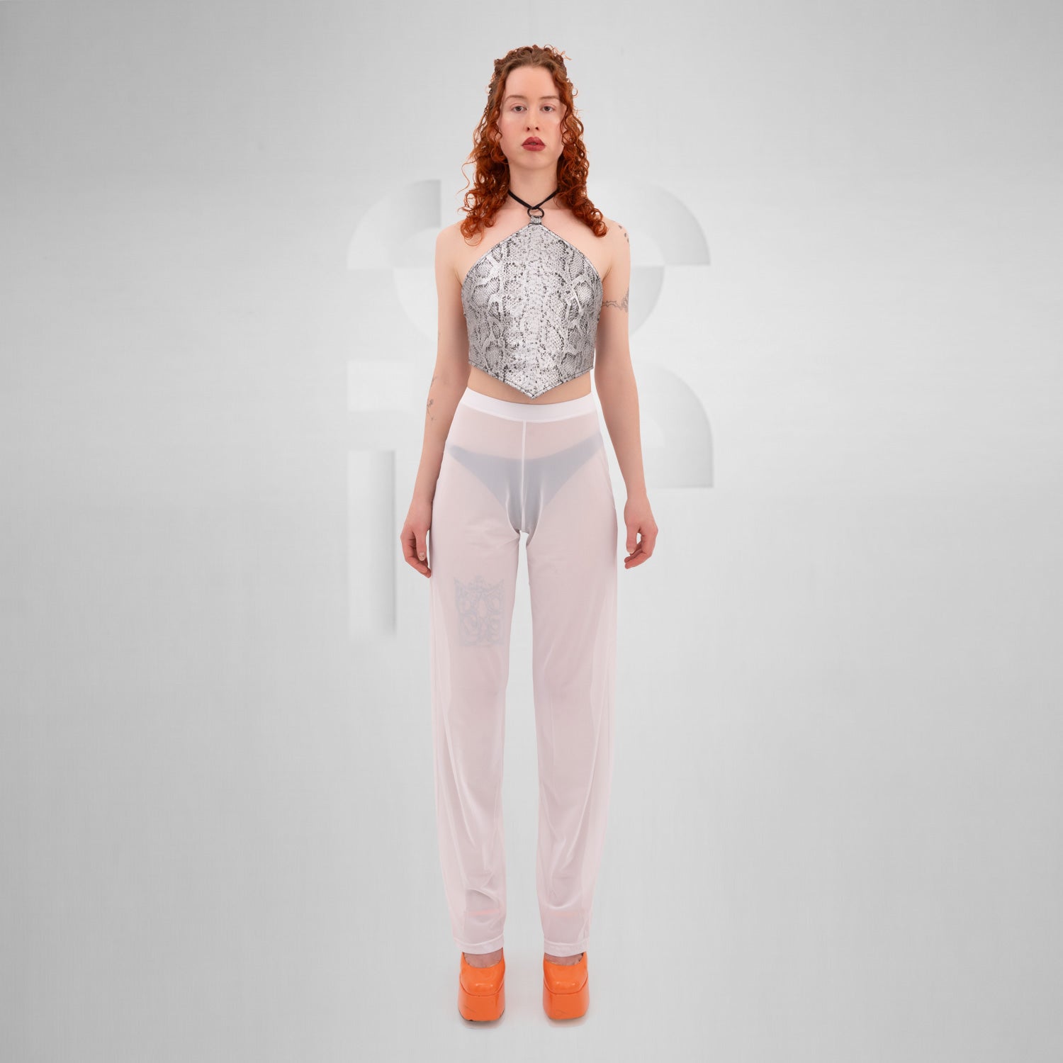 White Pants from THE CODE displayed on a model, showcasing their stylish, breathable design ideal for summer and nightlife.