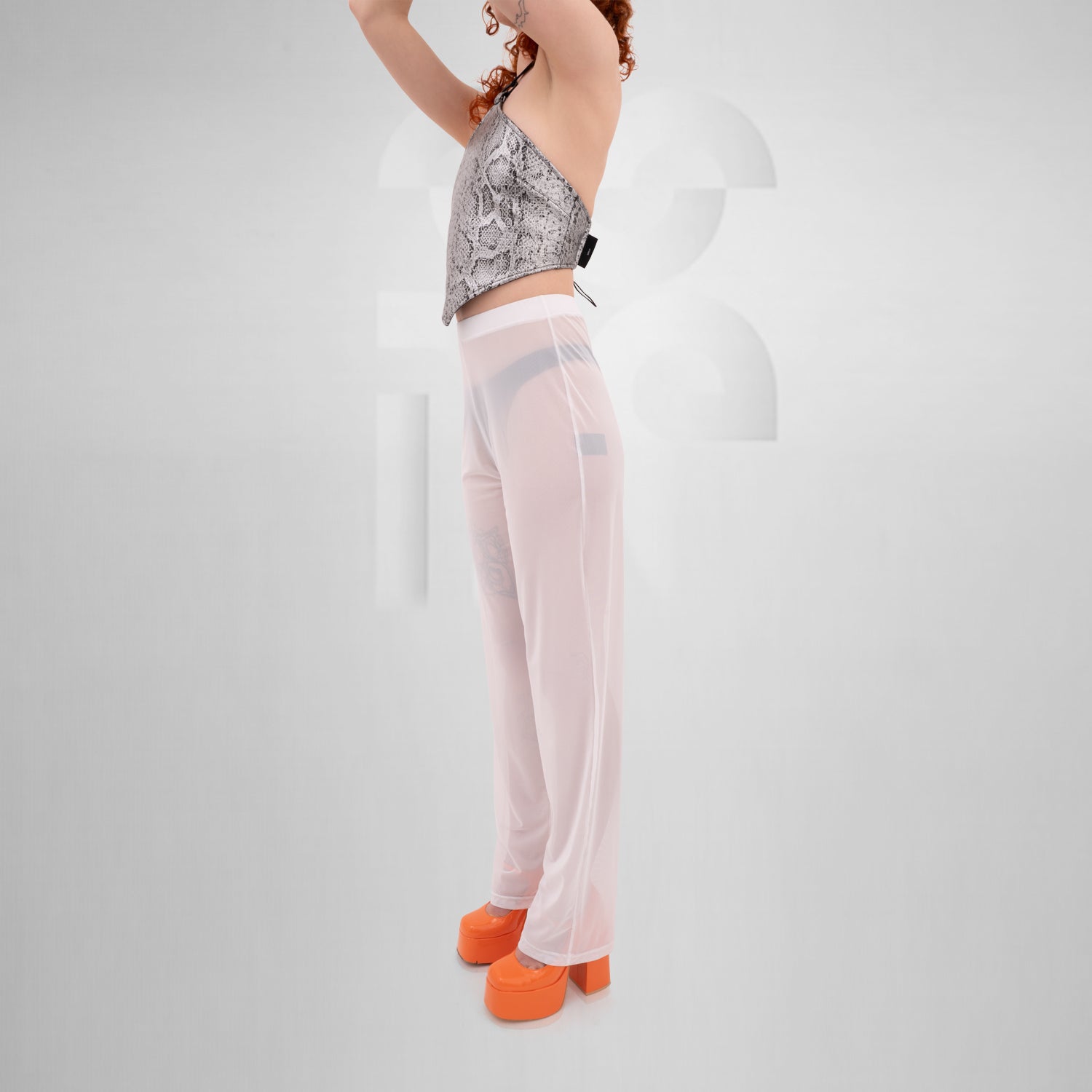 White Pants from THE CODE displayed on a model, showcasing their stylish, breathable design ideal for summer and nightlife.