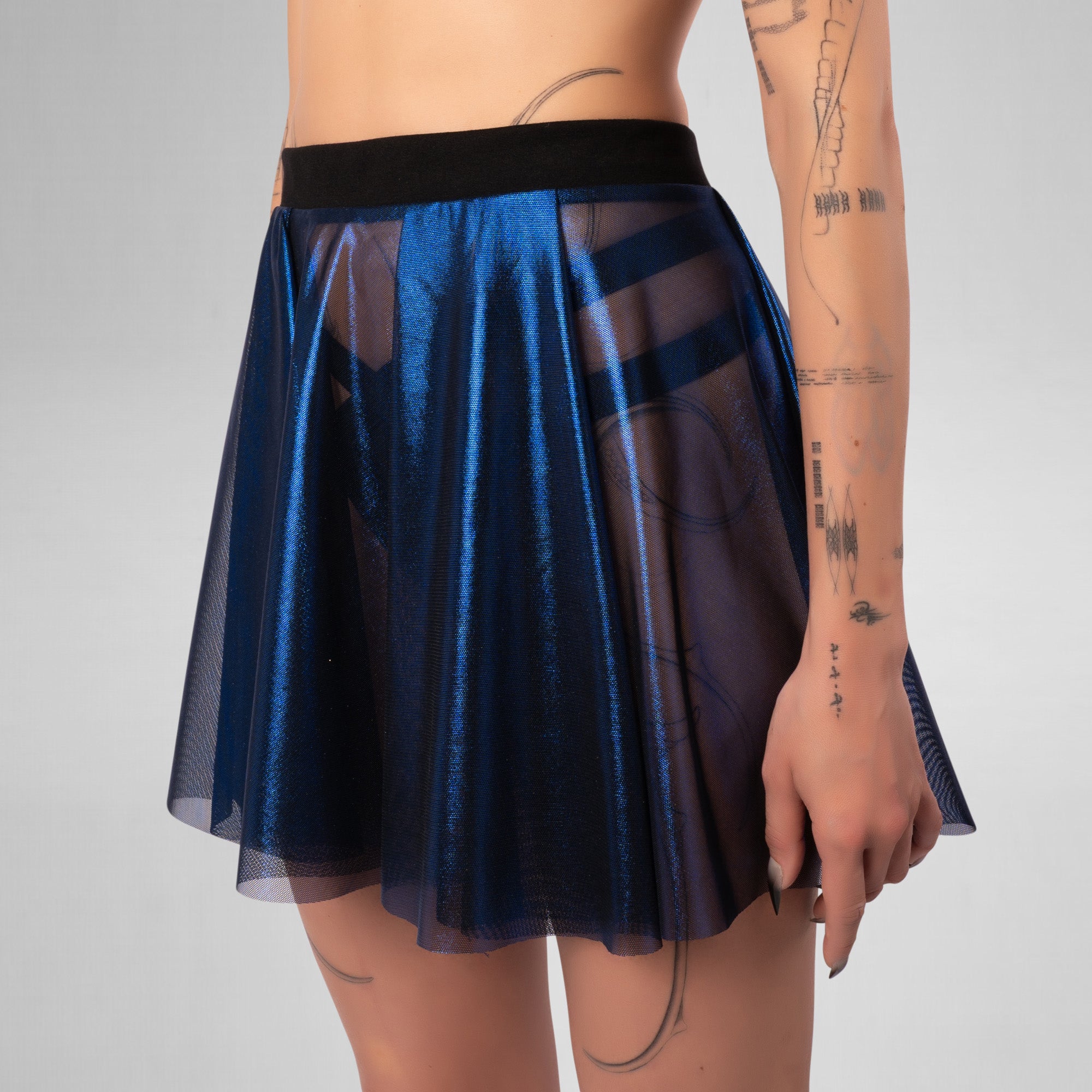 Navy blue sheer skirt worn by a person on a plain background