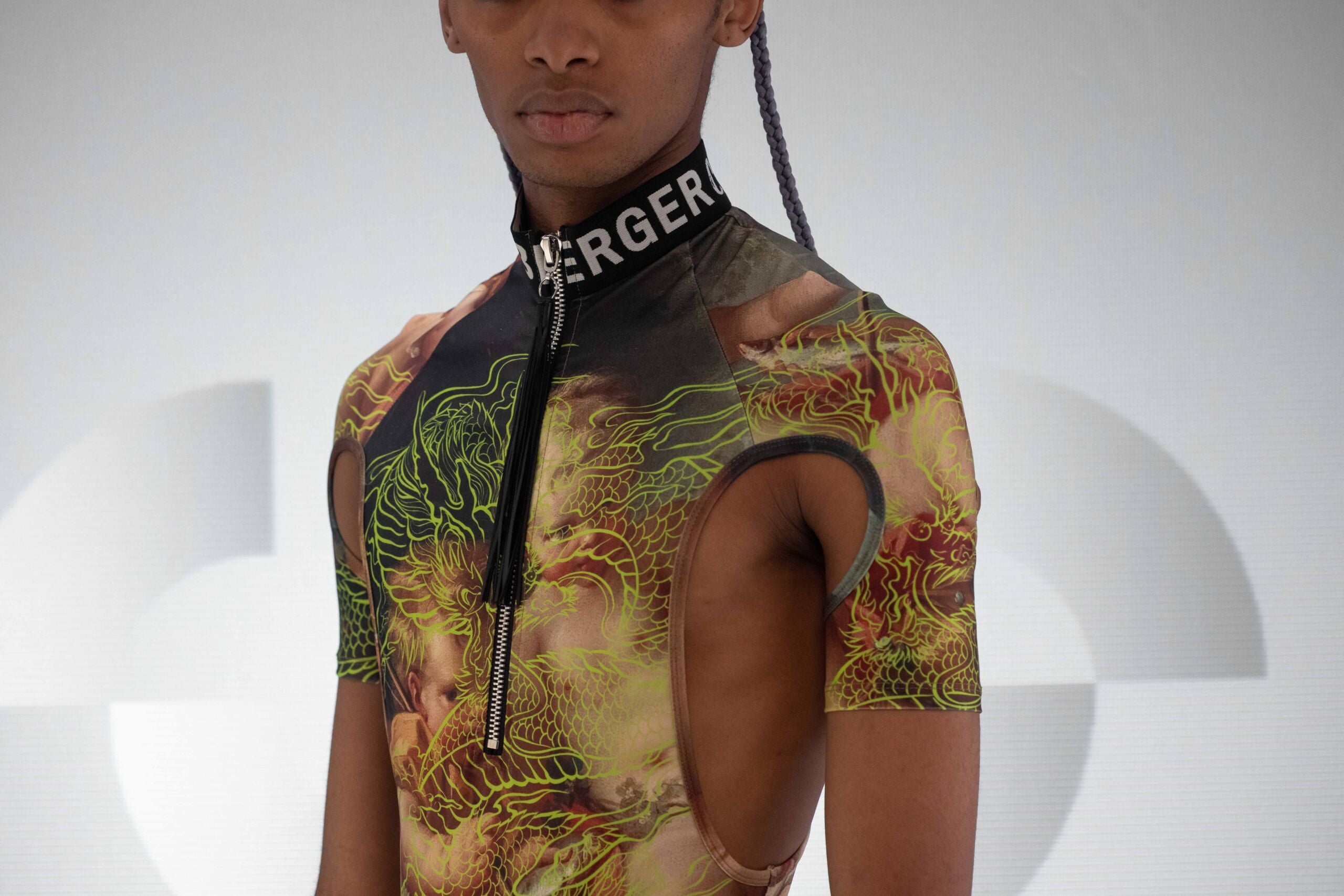 Detail view of the igniting Neon Dragon Bodysuit with high neck and a thong by Effenberger Couture. 