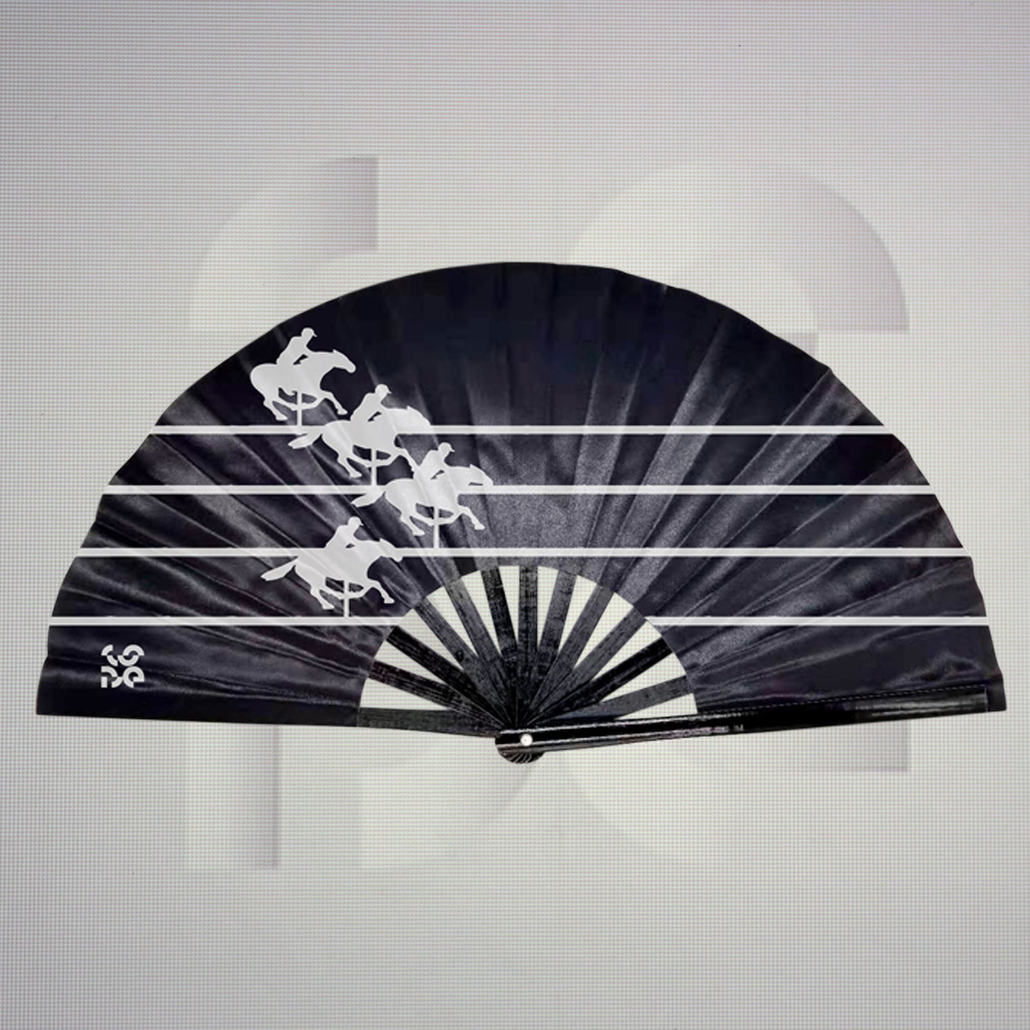 This is a folding fan featuring a sleek black design with striking white silhouettes of galloping horses. The dynamic imagery captures movement and energy, making it a stylish accessory for any occasion.
