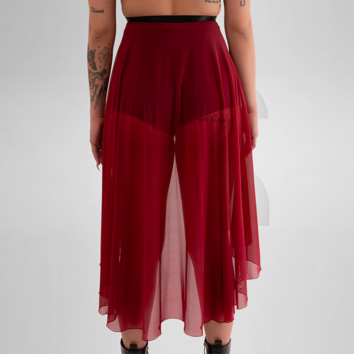 Sheer, flowing asymmetric Mesh Skirt in Red, equipping you for ruling the night in edgy elegance.