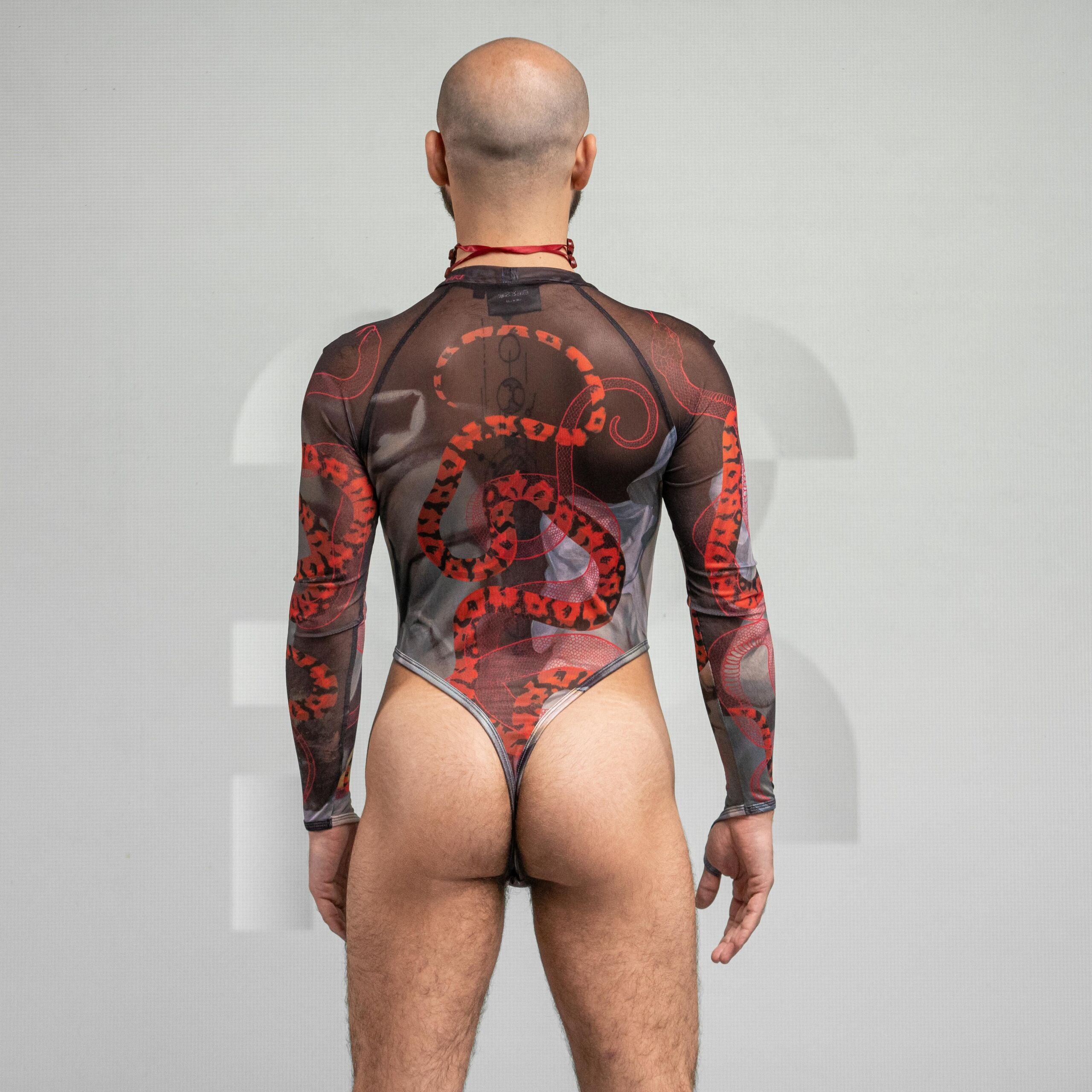 Back view of the artsy yet edgy Serpent Print Bodysuit with long sleeves and a thong by Effenberger Couture. 