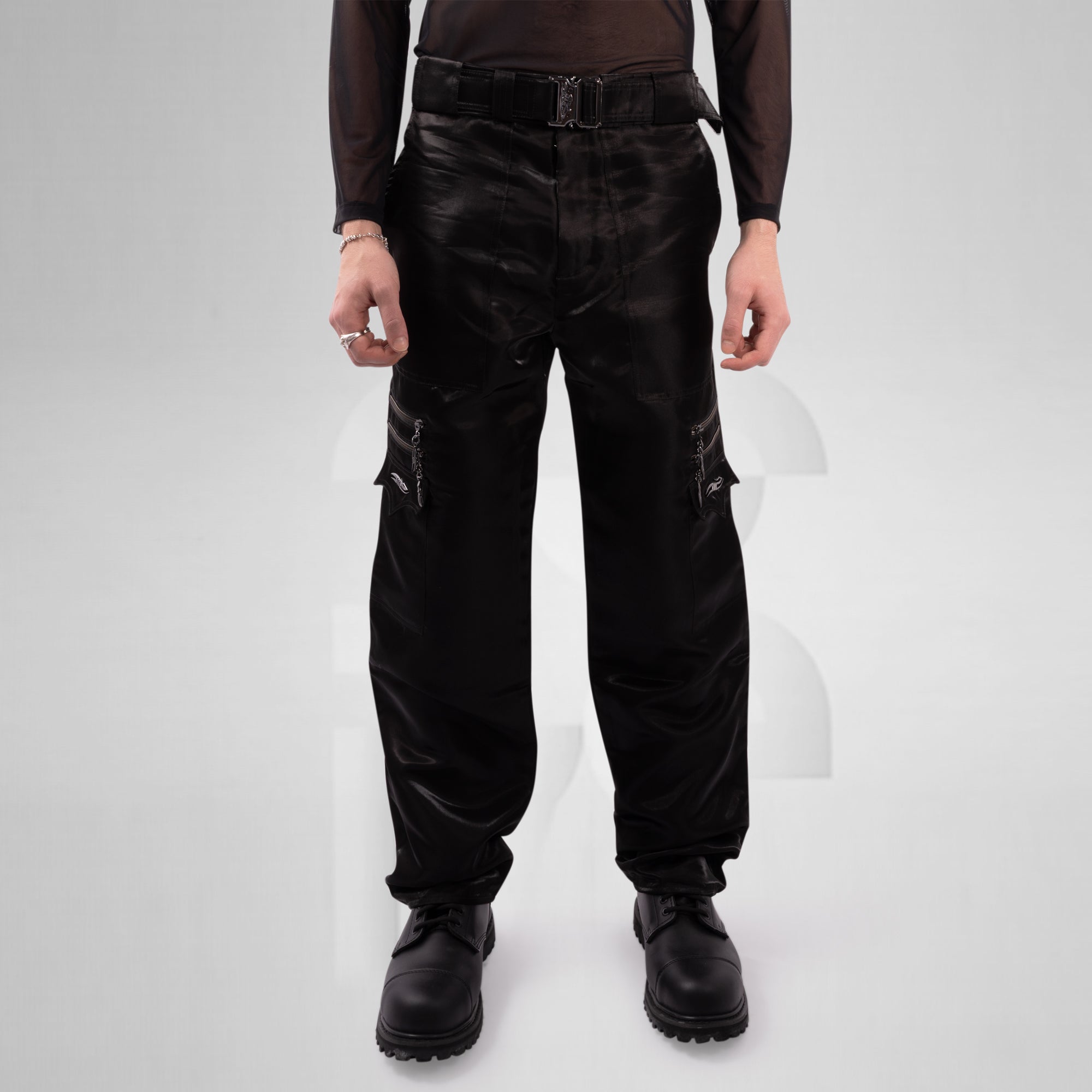 Person wearing black pants and shoes on a white background