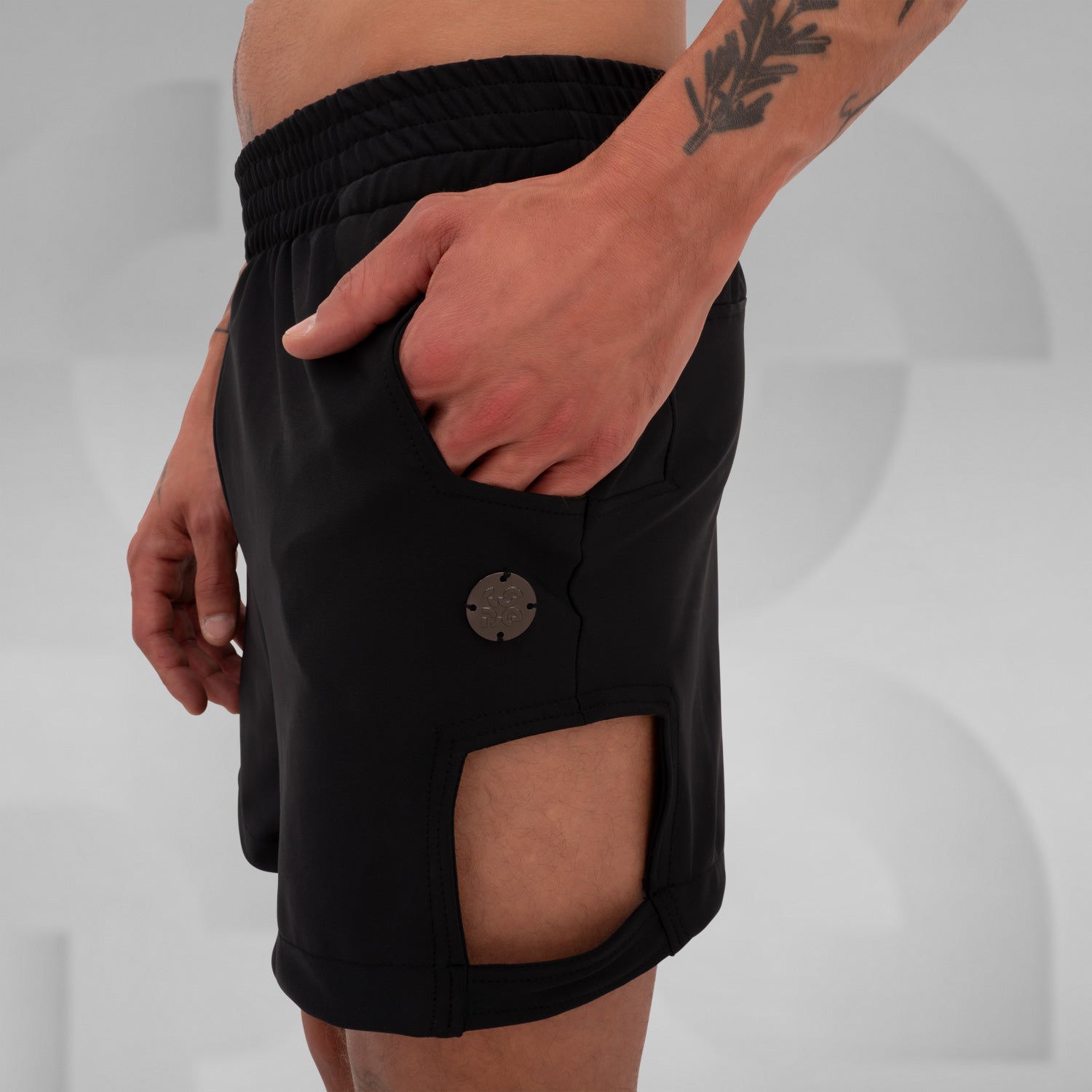 Black sporty shorts with side cut-outs and pockets, perfect for Berlin nightlife.