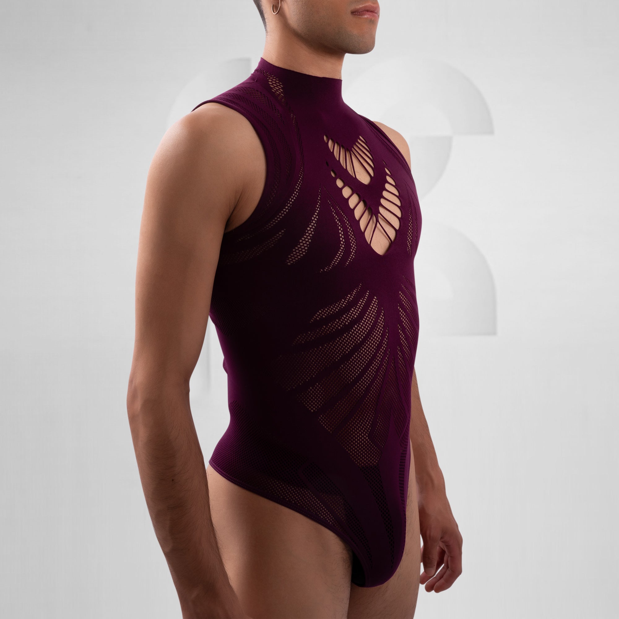 Person wearing a maroon swimsuit with cut-out design on a white background