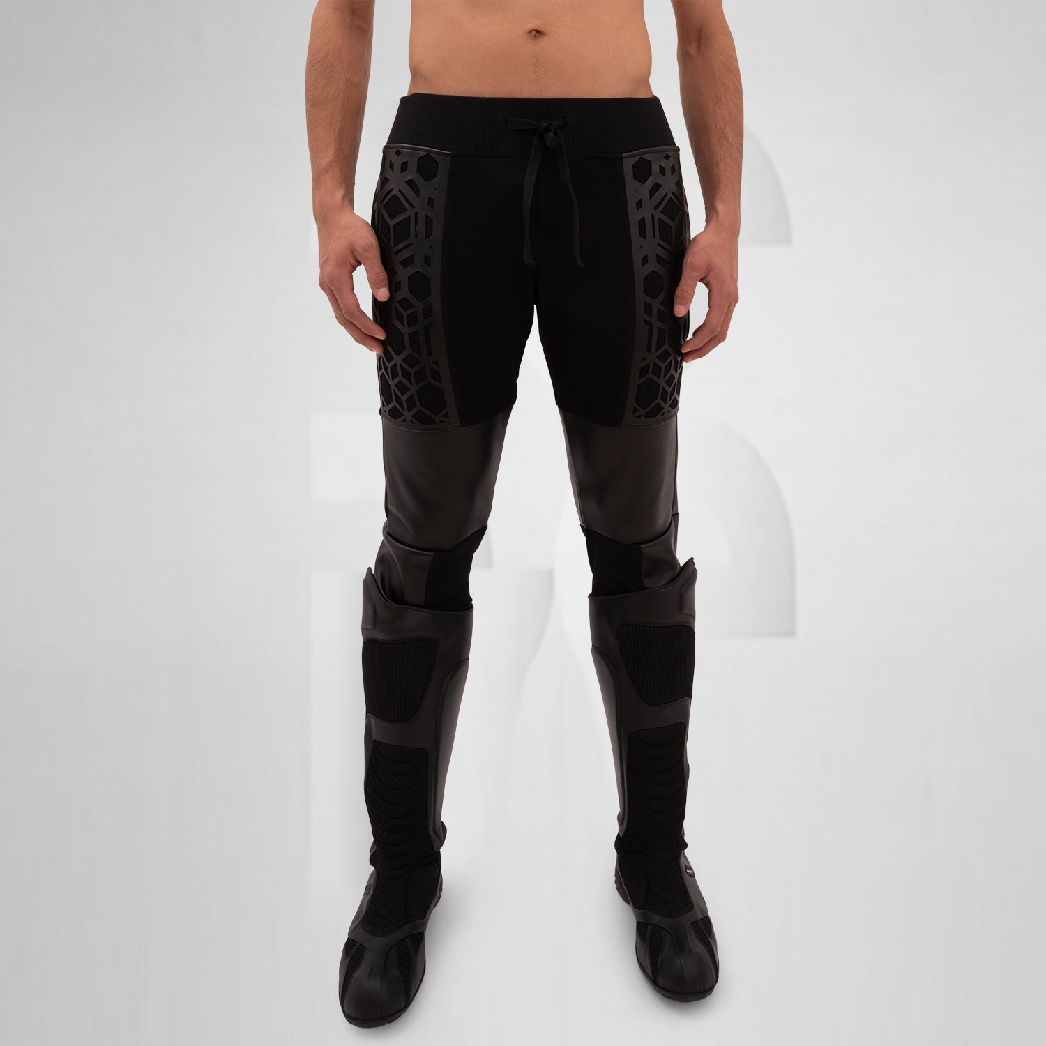 The Vegan Leather Laser-Cut Jogger Pants feature a unique design that seamlessly blends comfort with edgy style. Crafted from high-quality vegan leather, these joggers showcase intricate laser-cut detailing on the side panels, adding a bold dimension to your outfit. Equipped with a drawstring waist for an adjustable fit, they provide both functionality and flair. The jogger style also includes practical side patch pockets, making them perfect for any on-the-go lifestyle. Ideal for fashion-forward individual