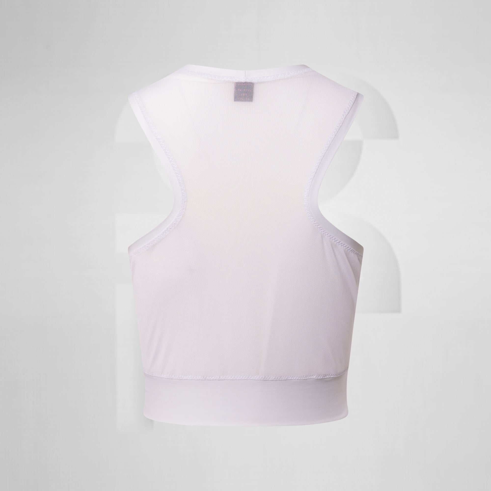 White mesh tank top in front of grey background