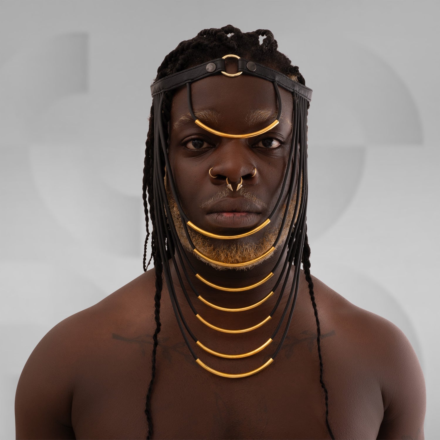 This eccentric headpiece is crafted from faux leather and designed to make a futuristic statement infused with ancient spirit.