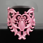 Introducing a stunning and opulent accessory that beautifully captures the essence of the Baroque era: the pink latex choker with a Baroque-style design.