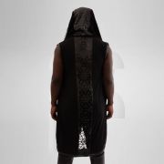 Black knitted hoodie with vegan leather details for a trendy and eco-friendly look