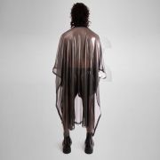 A striking long poncho in red, blue, and silver with a shiny disco festival vibe.