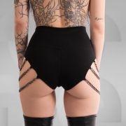 Black jersey hot pants with chains hanging on the side - a fashion statement that exudes edgy style and attitude.