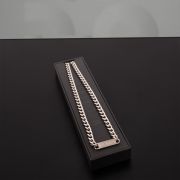 A glamorous Berlin chain necklace made of stainless steel, with a shiny plate centerpiece, radiating elegance and charm.