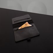 High-quality vegan leather tobacco pouch with RFID blocker and spacious compartments.