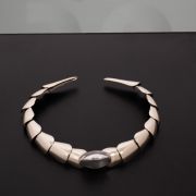 Silver necklace with overlapping movable scales crafted out of white brass