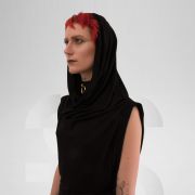 Black tube dress with unique neck detail that can be worn as a hoodie, creating an avant-garde look.