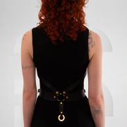 Vegan leather harness with metallic rings and crystal pendant in the center front