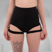 Side view of high-waisted black shorts with attached garter straps, designed for the Berlin club scene and edgy nightlife fashion.