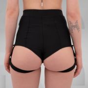 Side view of high-waisted black shorts with attached garter straps, designed for the Berlin club scene and edgy nightlife fashion.